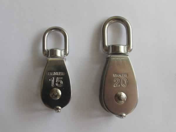 Two stainless steel lifting swivel singlepulley block for rope in different size.